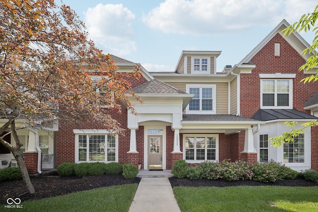 15553 Portland Dr, Westfield, IN 46074 - view of front facade featuring roof with shingles, brick siding, and a front yard