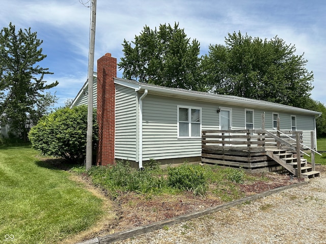 4673 S 400 W, New Palestine, IN 46163 - view of front of house with a chimney, a wooden deck, and a front yard