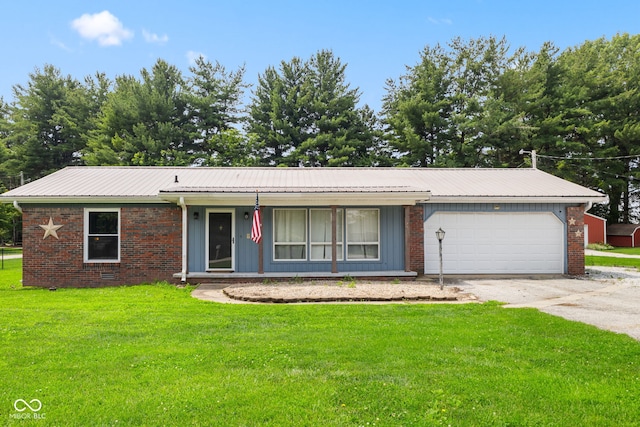 1532 E Range Line Rd, Greencastle, IN 46135 - ranch-style house with driveway, a garage, a front yard, a metal roof, and brick siding