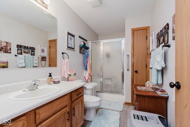 5515 Gateridge Ln, Indianapolis, IN 46237 - bathroom featuring a stall shower, vanity, and wood finished floors