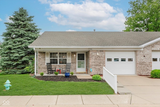 5515 Gateridge Ln, Indianapolis, IN 46237 - single story home featuring brick siding, concrete driveway, a porch, an attached garage, and a front lawn