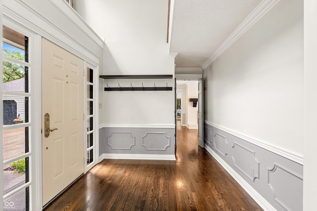 4443 Mallard Pt, Columbus, IN 47201 - foyer featuring ornamental molding, wainscoting, dark wood-type flooring, and a decorative wall