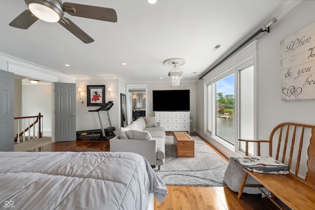 4443 Mallard Pt, Columbus, IN 47201 - bedroom featuring wood finished floors, crown molding, access to outside, recessed lighting, and ceiling fan