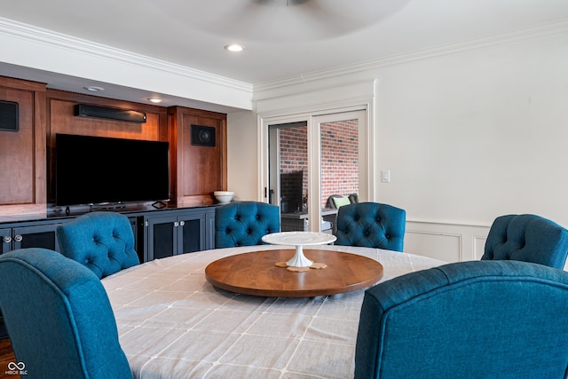 4443 Mallard Pt, Columbus, IN 47201 - dining area with crown molding, a wainscoted wall, and a decorative wall