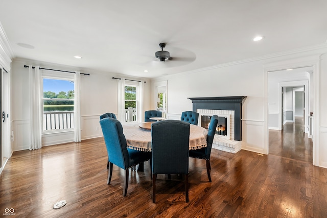 4443 Mallard Pt, Columbus, IN 47201 - dining room featuring ornamental molding, ceiling fan, a brick fireplace, dark wood-style floors, and recessed lighting