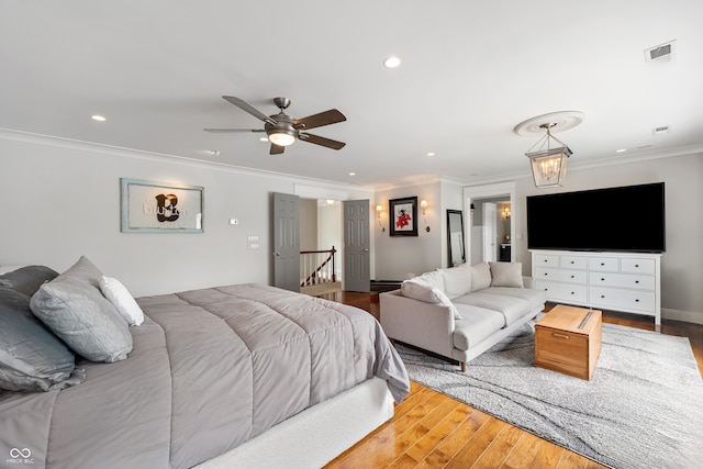4443 Mallard Pt, Columbus, IN 47201 - bedroom featuring ornamental molding, wood finished floors, recessed lighting, and ceiling fan
