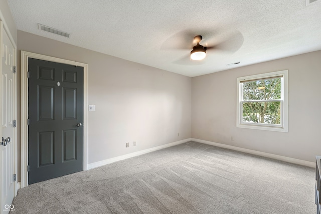 4443 Mallard Pt, Columbus, IN 47201 - unfurnished room with carpet floors, ceiling fan, and a textured ceiling