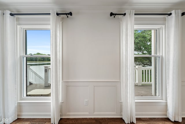 4443 Mallard Pt, Columbus, IN 47201 - doorway with a decorative wall, wainscoting, and crown molding