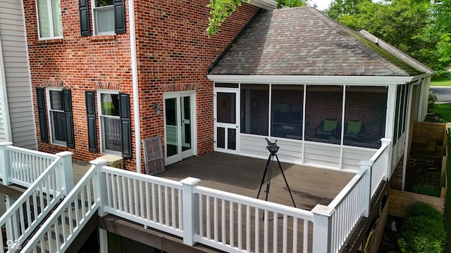 4443 Mallard Pt, Columbus, IN 47201 - view of property exterior featuring a sunroom, a deck, brick siding, and roof with shingles