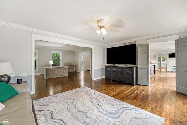4443 Mallard Pt, Columbus, IN 47201 - living area with wood finished floors, ornamental molding, and a ceiling fan