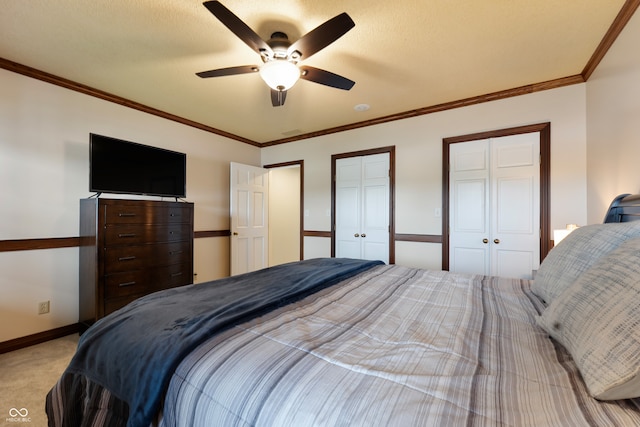 4443 Mallard Pt, Columbus, IN 47201 - bedroom featuring carpet flooring, multiple closets, a ceiling fan, and crown molding
