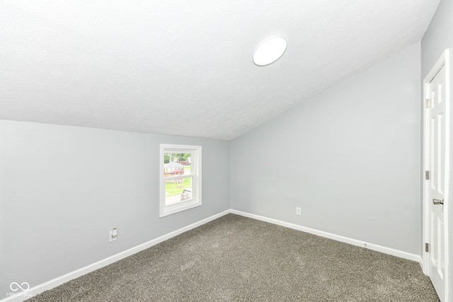2413 Fowler St, Anderson, IN 46012 - carpeted spare room featuring vaulted ceiling and a textured ceiling