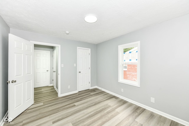 2413 Fowler St, Anderson, IN 46012 - unfurnished bedroom with light wood-type flooring