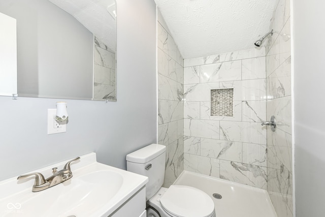 2413 Fowler St, Anderson, IN 46012 - full bathroom with tiled shower, vanity, and a textured ceiling