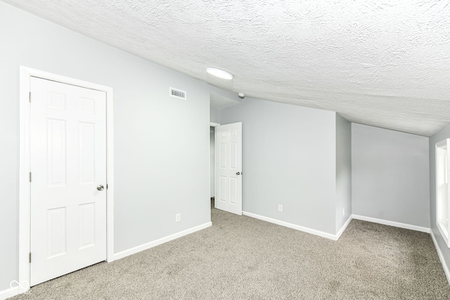 2413 Fowler St, Anderson, IN 46012 - below grade area featuring carpet and a textured ceiling