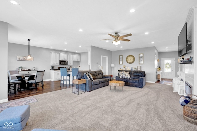 3072 W Glacier Dr, Monrovia, IN 46157 - living room featuring a ceiling fan, dark colored carpet, recessed lighting, and dark wood-type flooring
