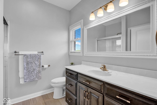 3072 W Glacier Dr, Monrovia, IN 46157 - full bathroom featuring vanity, wood finished floors, and a shower with door