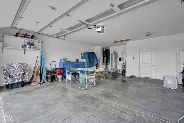 3072 W Glacier Dr, Monrovia, IN 46157 - garage featuring a garage door opener and water heater