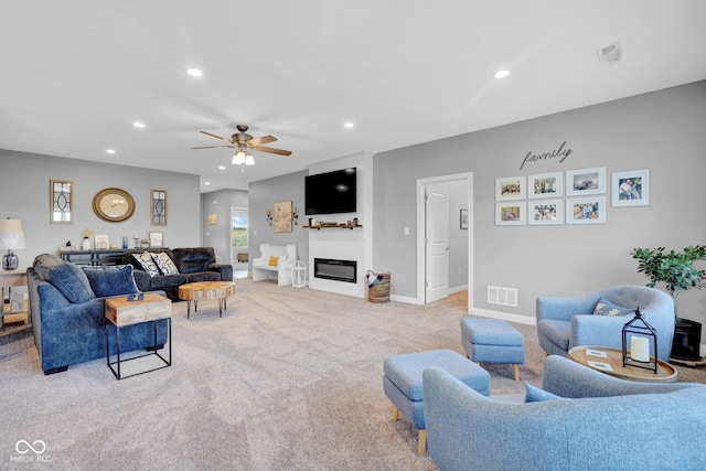 3072 W Glacier Dr, Monrovia, IN 46157 - living room featuring carpet flooring, recessed lighting, a ceiling fan, and a glass covered fireplace