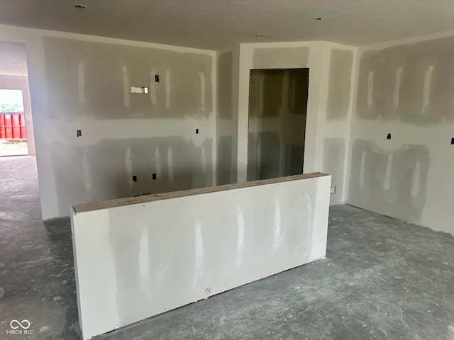 6812 Rawlings Ln, Indianapolis, IN 46221 - empty room featuring unfinished concrete flooring