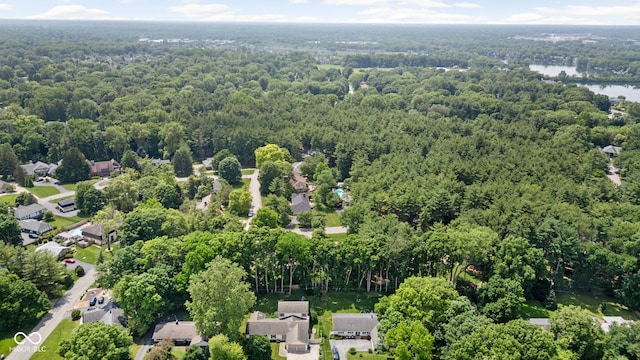 7629 Candlewood Ln, Indianapolis, IN 46250 - aerial view of residential area featuring a forest and a nearby body of water