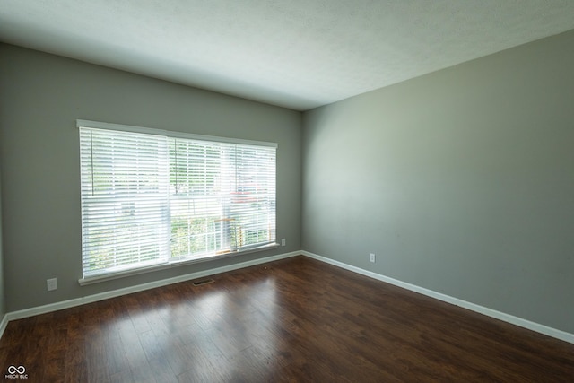 3610 Homestead Pl, Plainfield, IN 46168 - unfurnished room featuring baseboards and dark wood-style flooring
