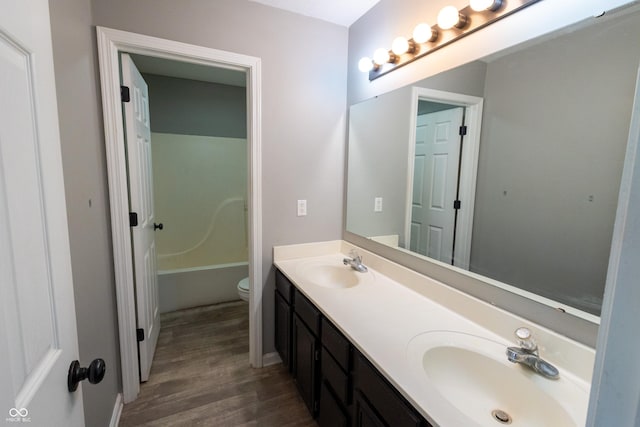 3610 Homestead Pl, Plainfield, IN 46168 - bathroom with wood finished floors, double vanity, and a bathtub