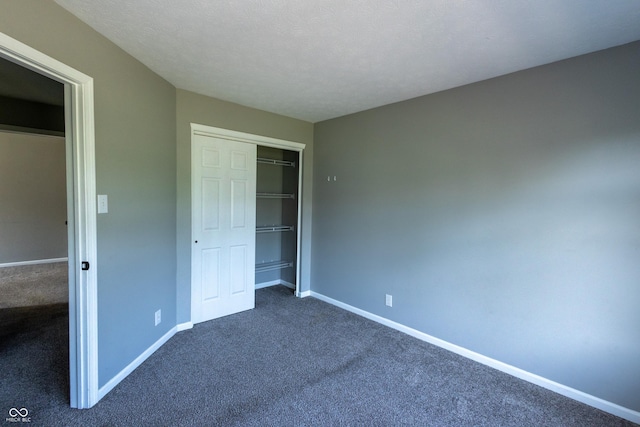 3610 Homestead Pl, Plainfield, IN 46168 - unfurnished bedroom featuring dark colored carpet and a closet
