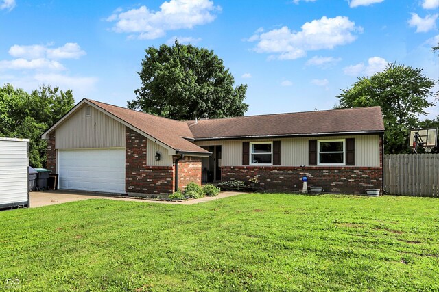 1759 Michele Ln, Greenwood, IN 46142 - view of front of home with brick siding, a garage, driveway, and a shingled roof