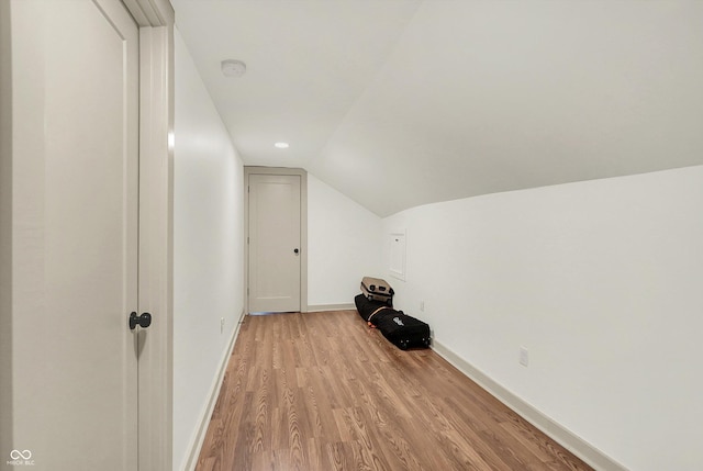 1046 N Hamilton Ave, Indianapolis, IN 46201 - additional living space with light wood-type flooring and vaulted ceiling