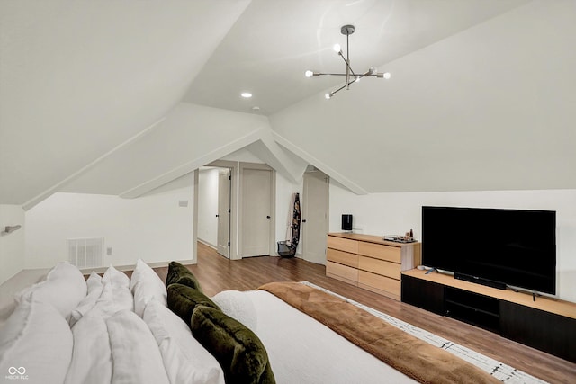 1046 N Hamilton Ave, Indianapolis, IN 46201 - bedroom with wood finished floors, lofted ceiling, a chandelier, and recessed lighting