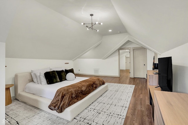 1046 N Hamilton Ave, Indianapolis, IN 46201 - bedroom featuring wood finished floors, lofted ceiling, and a chandelier