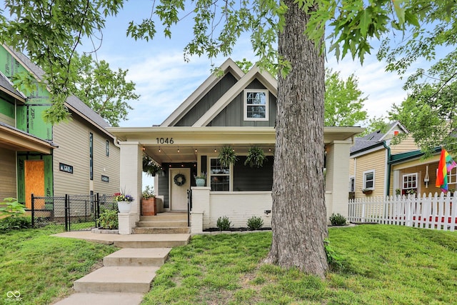1046 N Hamilton Ave, Indianapolis, IN 46201 - view of front of house featuring board and batten siding and brick siding