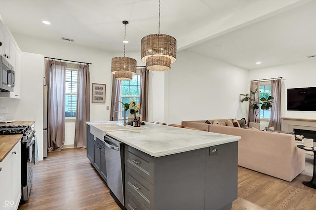 1046 N Hamilton Ave, Indianapolis, IN 46201 - kitchen with appliances with stainless steel finishes, gray cabinetry, plenty of natural light, white cabinetry, and recessed lighting
