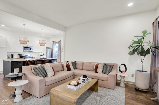 1046 N Hamilton Ave, Indianapolis, IN 46201 - living room featuring wood finished floors, recessed lighting, and a chandelier