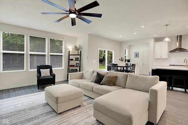 5306 Lavender Dr, Plainfield, IN 46168 - living room featuring light wood-type flooring, a ceiling fan, and recessed lighting