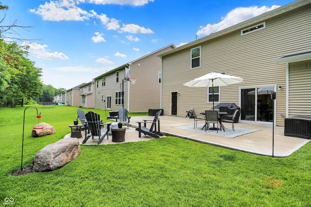 5306 Lavender Dr, Plainfield, IN 46168 - back of property featuring a patio area, an outdoor fire pit, and a lawn