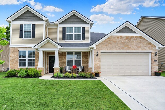 5306 Lavender Dr, Plainfield, IN 46168 - craftsman-style home featuring stone siding, driveway, covered porch, a front lawn, and a garage
