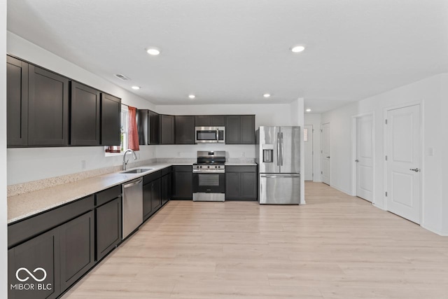 10107 Camp Creek Way, Indianapolis, IN 46229 - kitchen featuring appliances with stainless steel finishes, light wood-style floors, light countertops, and recessed lighting
