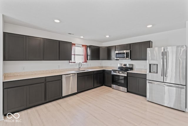 10107 Camp Creek Way, Indianapolis, IN 46229 - kitchen with appliances with stainless steel finishes, light wood-style flooring, light countertops, and recessed lighting