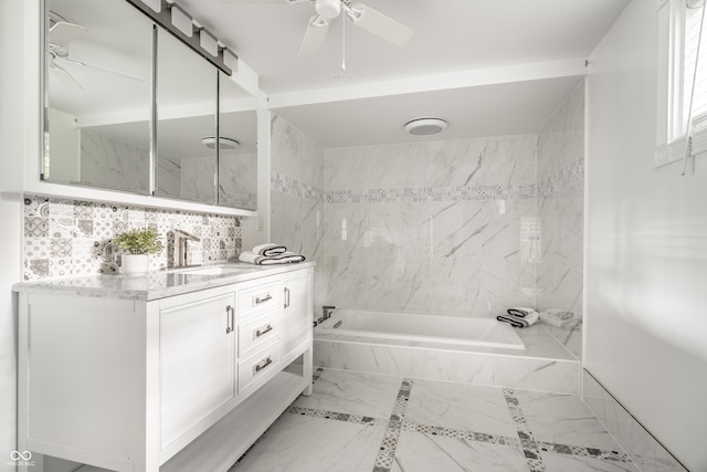 1515 Randall Rd, Indianapolis, IN 46240 - bathroom featuring a tub with marble appearance, vanity, and a ceiling fan