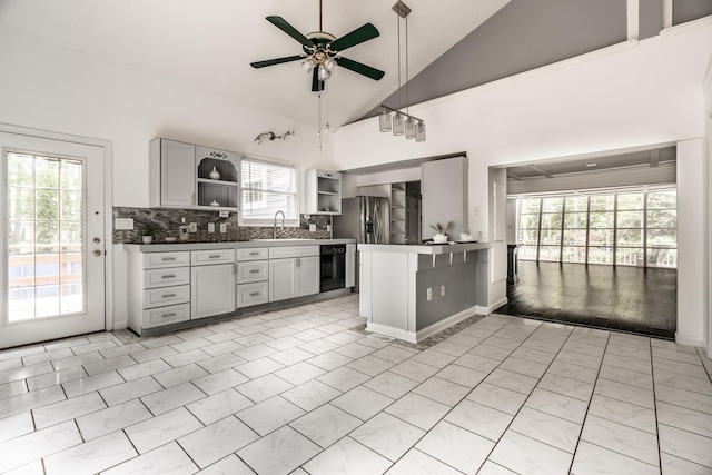 1515 Randall Rd, Indianapolis, IN 46240 - kitchen with open shelves, a ceiling fan, lofted ceiling, dark countertops, and healthy amount of natural light