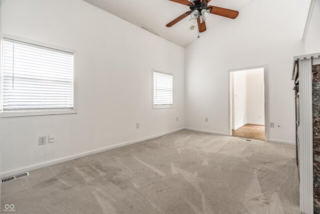 1515 Randall Rd, Indianapolis, IN 46240 - unfurnished bedroom with light carpet, high vaulted ceiling, and ceiling fan