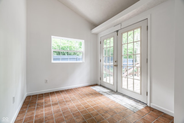 1515 Randall Rd, Indianapolis, IN 46240 - entryway with healthy amount of natural light, lofted ceiling, french doors, and tile patterned floors