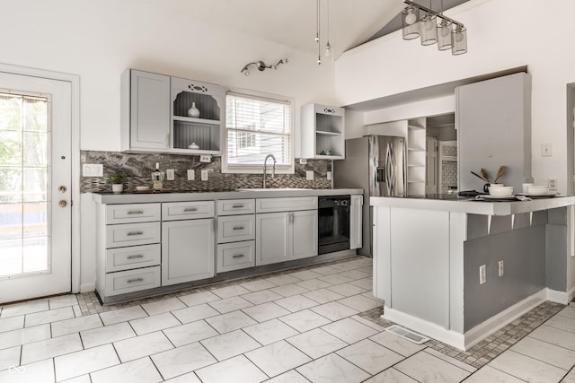 1515 Randall Rd, Indianapolis, IN 46240 - kitchen with open shelves, black dishwasher, dark countertops, lofted ceiling, and tasteful backsplash
