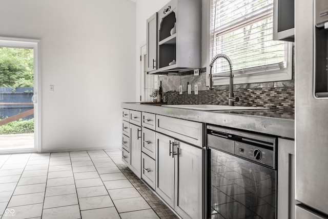 1515 Randall Rd, Indianapolis, IN 46240 - kitchen featuring black dishwasher, decorative backsplash, freestanding refrigerator, and open shelves