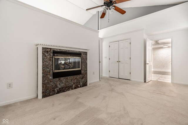 1515 Randall Rd, Indianapolis, IN 46240 - unfurnished living room featuring a ceiling fan, carpet, vaulted ceiling, and a premium fireplace