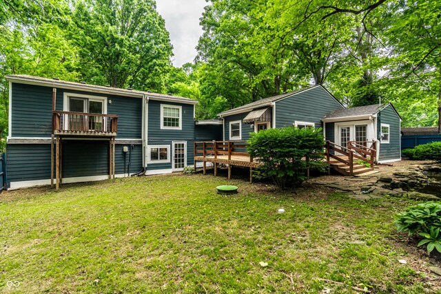 1515 Randall Rd, Indianapolis, IN 46240 - back of house featuring a deck, a lawn, an outdoor structure, and view of scattered trees