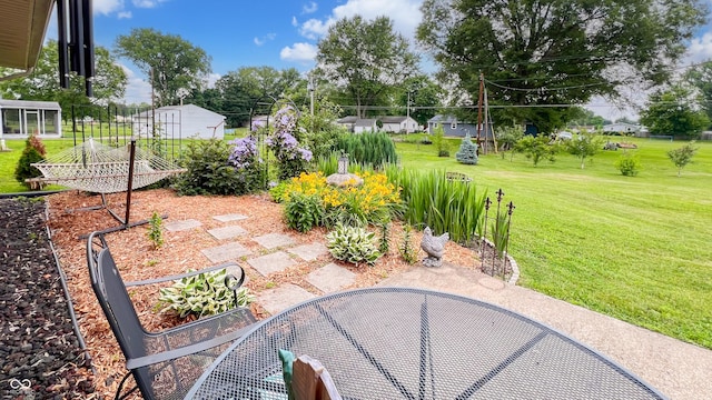 202 Collier St, Columbus, IN 47201 - view of patio featuring a garden