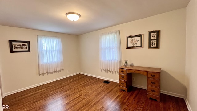 202 Collier St, Columbus, IN 47201 - unfurnished office with dark wood-style floors and baseboards